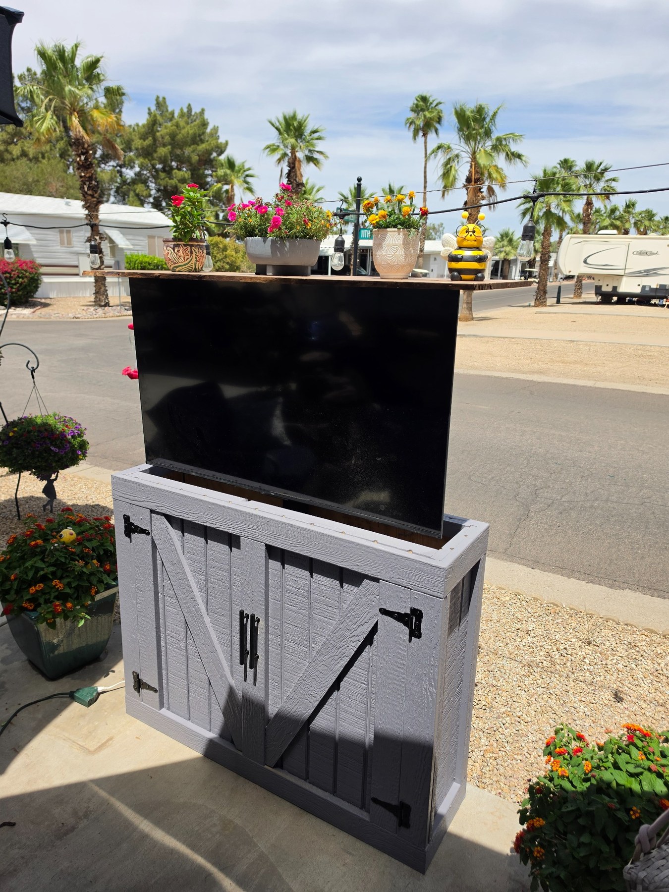TV raised from custom outdoor cabinet