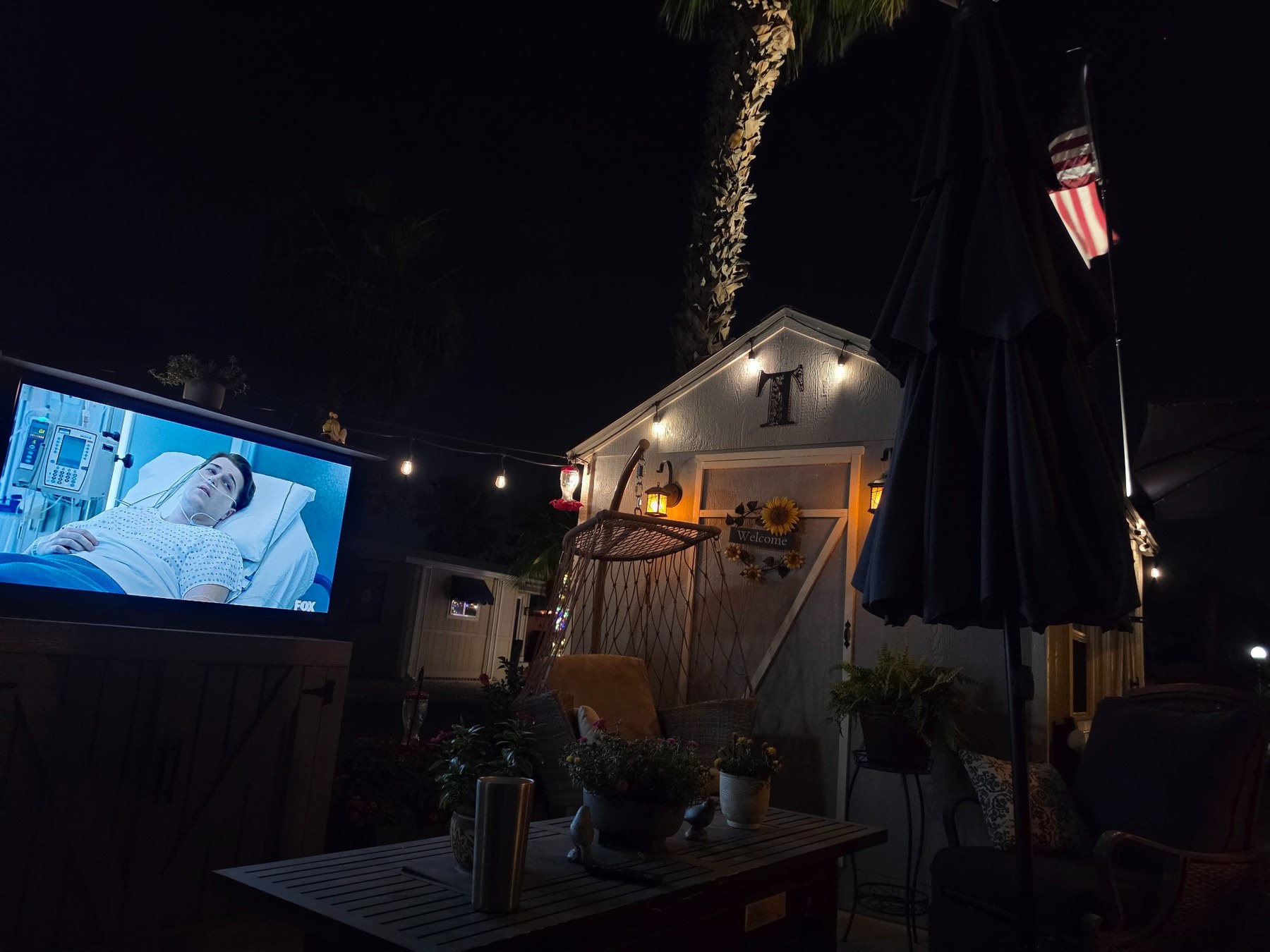 Outdoor TV cabinet viewing area at night